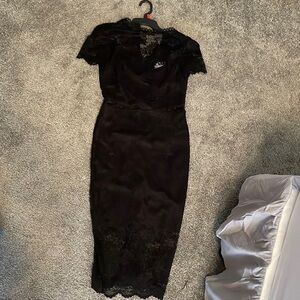 Black midi form fitting lace dress